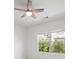 Bedroom featuring neutral colors and a ceiling fan above, with a window view of the exterior at 2251 W Village Se Ln, Smyrna, GA 30080