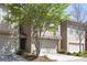 Well-lit townhouses boast driveway, garage, and meticulously manicured front yard at 2251 W Village Se Ln, Smyrna, GA 30080
