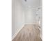 Bright hallway with laminate flooring leading to other areas of the home at 2251 W Village Se Ln, Smyrna, GA 30080