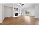 Spacious living room features a fireplace, built-in shelving, and a ceiling fan at 2251 W Village Se Ln, Smyrna, GA 30080