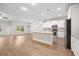 Expansive living room flows into a stylish kitchen with stainless appliances and island at 2251 W Village Se Ln, Smyrna, GA 30080