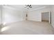 Bright main bedroom with neutral carpet, large open space, tray ceilings and natural light at 2251 W Village Se Ln, Smyrna, GA 30080