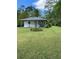 Charming single-story home featuring a well-manicured lawn and a welcoming front porch swing at 3127 Bright Star Rd, Douglasville, GA 30135