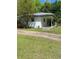 A white home featuring a covered porch and verdant surroundings at 3127 Bright Star Rd, Douglasville, GA 30135