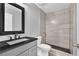 Modern bathroom featuring a glass shower, gray vanity and contemporary fixtures at 3505 Oakshire Se Way, Atlanta, GA 30354