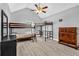 Bright bedroom with a ceiling fan, bunk beds, a wooden dresser, and grey walls at 3505 Oakshire Se Way, Atlanta, GA 30354