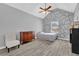 Bright bedroom with a ceiling fan, wooden dresser, grey walls and vinyl flooring at 3505 Oakshire Se Way, Atlanta, GA 30354