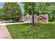 Charming two-story home with a two-car garage, stone accents and a well-manicured lawn at 3505 Oakshire Se Way, Atlanta, GA 30354