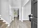 Bright foyer featuring new floors, a view to the kitchen, and access to the stairway at 3505 Oakshire Se Way, Atlanta, GA 30354