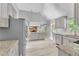 Well-lit kitchen featuring gray cabinets, granite counters and stainless steel appliances at 3505 Oakshire Se Way, Atlanta, GA 30354
