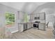 Kitchen features sleek gray cabinets, granite countertops, and stainless steel appliances at 3505 Oakshire Se Way, Atlanta, GA 30354