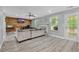 Comfortable living room with luxury vinyl plank, fireplace, wood accent wall and neutral colors at 3505 Oakshire Se Way, Atlanta, GA 30354