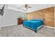 Spacious main bedroom featuring modern paneling, ceiling fan and neutral colors at 3505 Oakshire Se Way, Atlanta, GA 30354