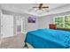 Relaxing main bedroom with a tray ceiling, ceiling fan and an ensuite bath at 3505 Oakshire Se Way, Atlanta, GA 30354