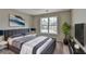 Serene bedroom features a large window offering plenty of natural light and neutral tones at 591 Paper Ridge Ct, Lawrenceville, GA 30046