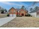 Charming two-story brick home with a well-manicured lawn and a two-car garage at 591 Paper Ridge Ct, Lawrenceville, GA 30046