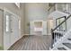 Grand foyer with soaring ceilings and open staircase, creating a welcoming entrance at 591 Paper Ridge Ct, Lawrenceville, GA 30046