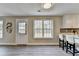 Kitchen eating area features a large window, door to outside, and modern finishes at 591 Paper Ridge Ct, Lawrenceville, GA 30046
