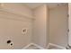 Functional laundry room with shelving, offering convenience and organization for laundry tasks at 591 Paper Ridge Ct, Lawrenceville, GA 30046