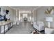 Open-concept living and dining area with wood-look flooring and stylish decor at 591 Paper Ridge Ct, Lawrenceville, GA 30046