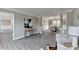 Open-concept living and dining area with wood-look flooring and stylish decor at 591 Paper Ridge Ct, Lawrenceville, GA 30046