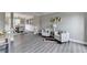 Open-concept living and dining area with wood-look flooring and stylish decor at 591 Paper Ridge Ct, Lawrenceville, GA 30046