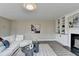 Inviting living room with fireplace, built-in shelving, and comfortable seating, ideal for relaxation at 591 Paper Ridge Ct, Lawrenceville, GA 30046