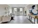 Bright room featuring wood-look floors, wainscoting, and two windows offering ample natural light at 591 Paper Ridge Ct, Lawrenceville, GA 30046