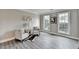Bright room featuring wood-look floors, wainscoting, and two windows offering ample natural light at 591 Paper Ridge Ct, Lawrenceville, GA 30046