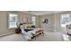 Spacious main bedroom with plush carpet, neutral walls, and bright windows at 591 Paper Ridge Ct, Lawrenceville, GA 30046