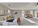 Large main bedroom with bright windows, carpet floors and sitting area at 591 Paper Ridge Ct, Lawrenceville, GA 30046