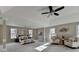 Serene main bedroom with tray ceilings, large windows, and ample space for a comfortable retreat at 591 Paper Ridge Ct, Lawrenceville, GA 30046