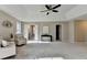 Expansive main bedroom showcasing tray ceiling and sitting area at 591 Paper Ridge Ct, Lawrenceville, GA 30046
