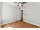 This bedroom includes a ceiling fan, hardwood floors, and closet space at 2081 Verbena Nw St, Atlanta, GA 30314