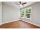Bedroom featuring hardwood floors, neutral paint, a modern ceiling fan, and bright windows at 2081 Verbena Nw St, Atlanta, GA 30314