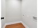 Practical laundry room featuring hardwood floors, neutral walls, and washer/dryer hookups at 2081 Verbena Nw St, Atlanta, GA 30314