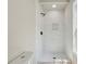 Modern bathroom featuring a shower with a white marble tile surround at 2081 Verbena Nw St, Atlanta, GA 30314