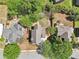 An aerial view shows a house with a gray roof, surrounded by trees and lawn at 2124 Marshalls Se Ln, Atlanta, GA 30316