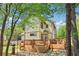 Backyard view featuring a wooden deck with comfortable seating and an outdoor grill at 2124 Marshalls Se Ln, Atlanta, GA 30316