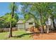 Backyard showcasing a wooden deck, a well-maintained lawn, mature trees, and privacy fencing at 2124 Marshalls Se Ln, Atlanta, GA 30316