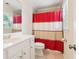 Clean bathroom with a large mirror and a red and white shower curtain at 2124 Marshalls Se Ln, Atlanta, GA 30316