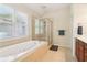 Bathroom showcasing a soaking tub and separate glass shower at 2124 Marshalls Se Ln, Atlanta, GA 30316