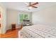 Cozy bedroom with hardwood floors, a ceiling fan and a work desk at 2124 Marshalls Se Ln, Atlanta, GA 30316