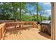 Spacious wooden deck featuring a wood railing, steps to the yard, and a built in grill at 2124 Marshalls Se Ln, Atlanta, GA 30316