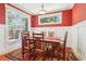 Traditional dining room with wainscoting and a bright window overlooking the front yard at 2124 Marshalls Se Ln, Atlanta, GA 30316