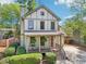 Charming two-story home with a landscaped yard, covered porch, and inviting curb appeal at 2124 Marshalls Se Ln, Atlanta, GA 30316