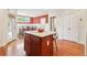 Bright eat-in kitchen featuring a center island with granite countertop and hardwood floors at 2124 Marshalls Se Ln, Atlanta, GA 30316