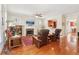Cozy living room showcasing hardwood floors, a fireplace, and an open view to the kitchen at 2124 Marshalls Se Ln, Atlanta, GA 30316