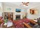 Inviting living room with a fireplace, mounted TV, hardwood floors, and cozy seating at 2124 Marshalls Se Ln, Atlanta, GA 30316