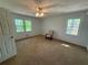 Bright bedroom featuring two large windows and neutral carpeting at 3013 Barcelona Way, Conyers, GA 30012